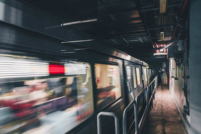 Blurred motion of train at railroad station platform