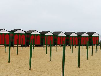 Multi colored umbrellas on beach against sky