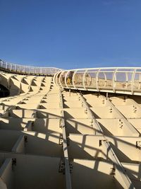 Built structure against clear blue sky on sunny day