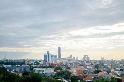 Modern buildings in city against sky