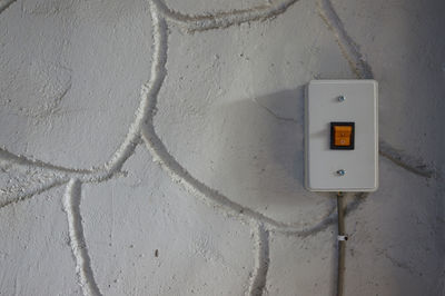 Electric switch mounted on wall