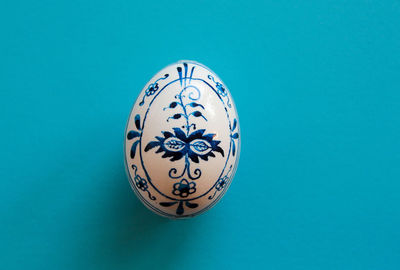 High angle view of electric lamp against blue background