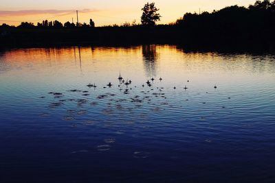 Scenic view of lake against sky during sunset