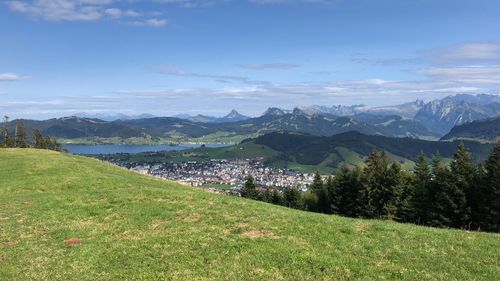 Scenic view of landscape and mountains against sky