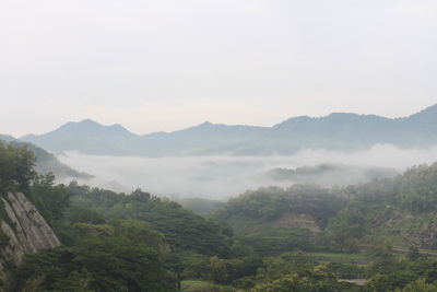 Scenic view of mountains against sky, wonorejo reservoir.