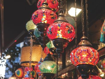 Low angle view of illuminated lanterns hanging in market