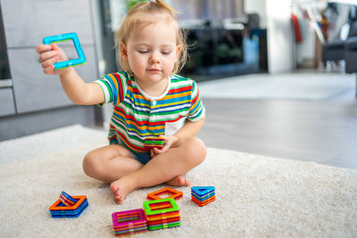 Portrait of cute girl using mobile phone