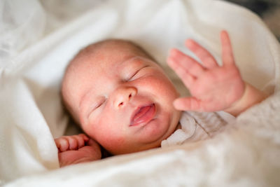 High angle view of cute baby sleeping