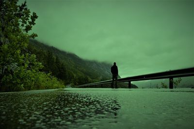 Surface level of bridge over river against sky