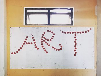 Close-up of red paint on white wall