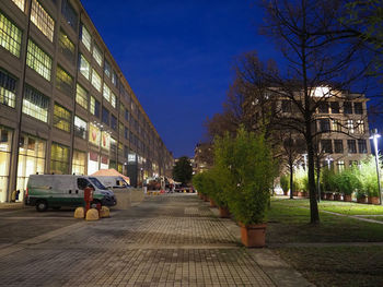 Street amidst buildings in city against sky