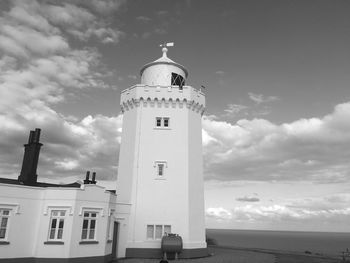 Low angle view of building against cloudy sky