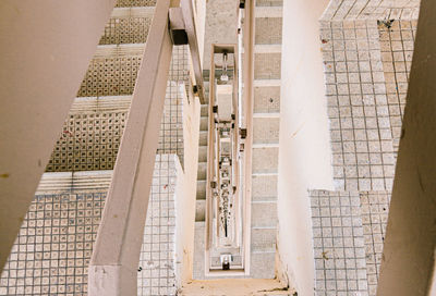 Cropped image of man standing on steps