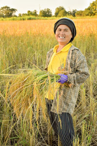 Portrait of smiling farmer working in farm