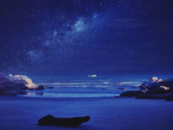 Scenic view of sea against sky at night