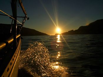 Close-up of sea against sky during sunset