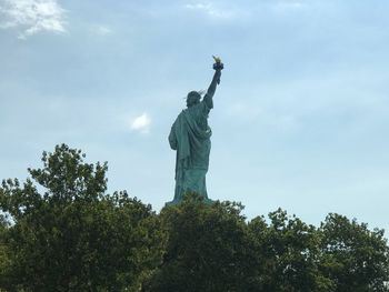 Low angle view of statue against sky