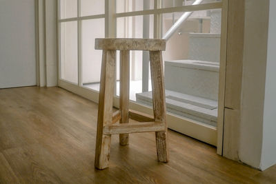 A small wooden chair is used as a photo studio decoration.