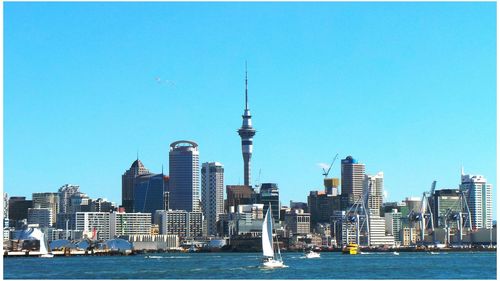 View of skyscrapers against blue sky