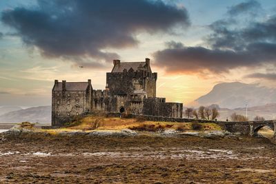 Old ruin building against sky during sunset