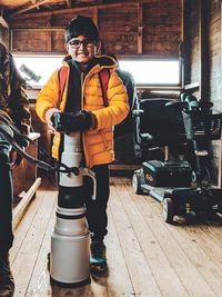 Kid photographer trying to carry a big lens