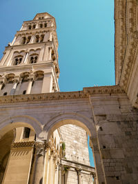 Low angle view of old building against clear sky