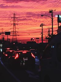 Car moving on road at sunset