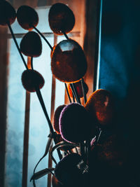Close-up of electric lamp hanging at home