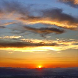 Scenic view of dramatic sky during sunset