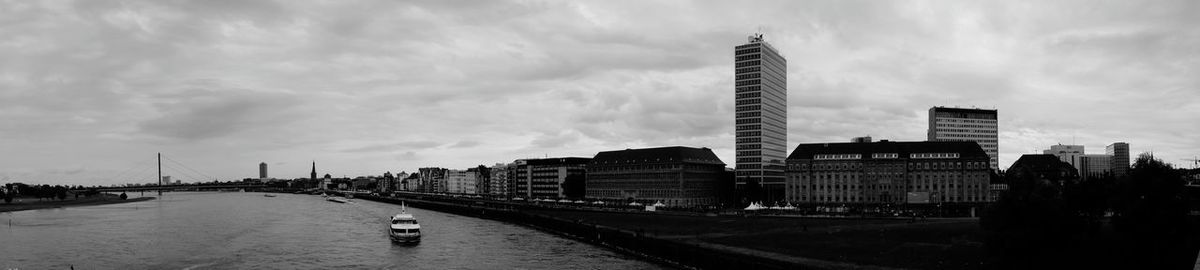 Cityscape against cloudy sky