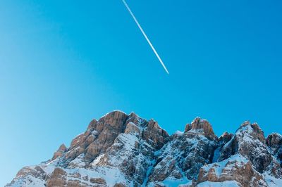 Low angle view of mountain against clear blue sky