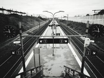Train on railroad tracks against sky