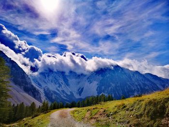 Scenic view of snowcapped mountains against sky