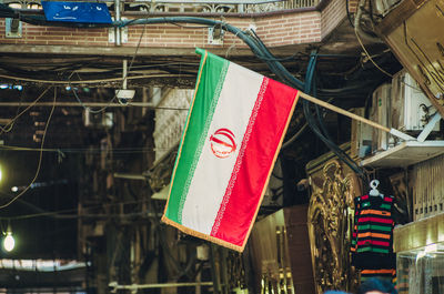 Multi colored flags hanging on rope