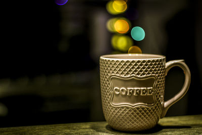 Close-up of coffee cup on table