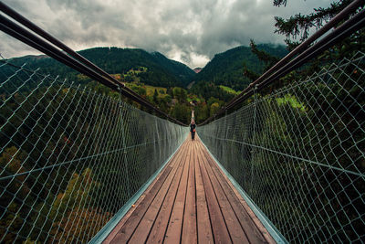 Hiking on a pedestrian suspension bridge in switzerland.