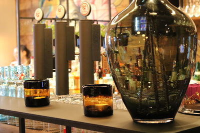 Close-up of beer bottles on table