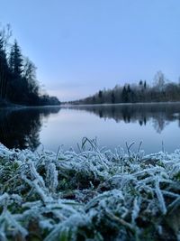 Scenic view of frozen lake against sky