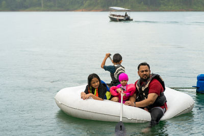 People on boat in lake