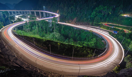 High angle view of light trails on road at night