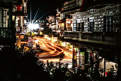 High angle view of light trails on road at night