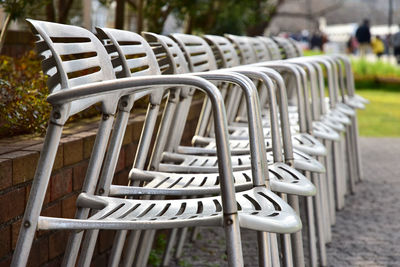 Close-up of many empty chairs