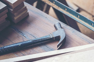 High angle view of hammer on table