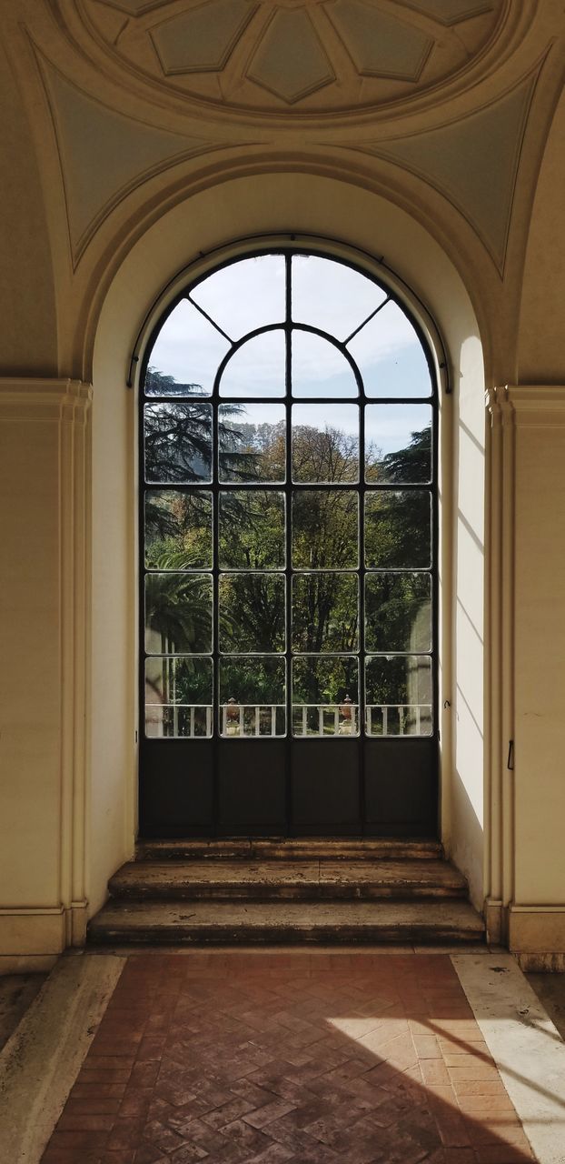 VIEW OF BUILDING THROUGH WINDOW