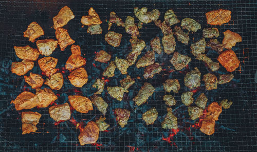 High angle view of meat on barbecue grill