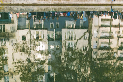 Reflection of building in puddle