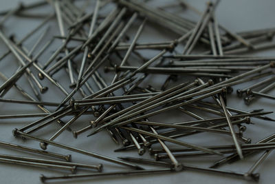 Close-up of nails on white background