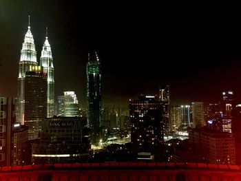 Illuminated buildings in city at night