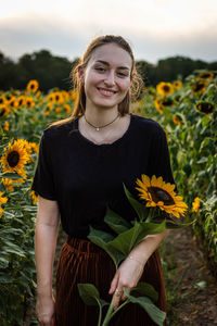 Portrait of a smiling young woman in the field