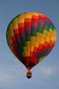 Low angle view of hot air balloon flying in sky